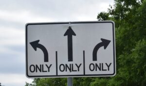 road sign Greg Jewett Unsplash scaled